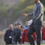 Tiger Woods throws his club on the 18th hole during the first round of the U.S. Open golf tournament Thursday, June 17, 2010, at the Pebble Beach Golf Links in Pebble Beach, Calif. (AP Photo/Chris Carlson)