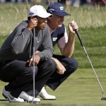 Tiger Woods, left, and Ernie Els of South Africa line up putts on the 12th hole during the first round of the U.S. Open golf tournament Thursday, June 17, 2010, at the Pebble Beach Golf Links in Pebble Beach, Calif. (AP Photo/Chris Carlson)