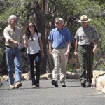 Vice President Joe Biden, left, walks hand in hand with his daughter along the rim of the Grand Canyon Tuesday, July 27, 2010. At their right is Jon Jarvis, director of the National Park Service, and Steve Martin, far right, Grand Canyon superintendent. (AP Photo/Felicia Fonseca)