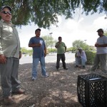 From left, day laborers Raymond Mesa, of Honduras, Jose Mendoza, of Mexico, "Dias", and Poncho Hernandez, of Mexico and a man who asked not to be identified stand outside a store Wednesday, July 28, 2010 in Phoenix. All the men said they were pleased with Federal Judge Bolton's ruling which blocked the most controversial sections of Arizona's new immigration law, SB1070, from taking effect Thursday, handing a major legal victory to opponents of the crackdown. The law will still take effect Thursday, but without many of the provisions that angered opponents - including sections that required officers to check a person's immigration status while enforcing other laws. (AP Photo/Matt York)