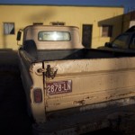 A truck with old Arizona state license plates sits parked near the port of entry in San Luis Rio Colorado, Mexico, on the other side of the border from the U.S. city of Yuma, Arizona, Thursday July 29, 2010. A U.S. federal judge blocked on Wednesday the most controversial parts of Arizona's immigration law from taking effect. The overall law will still take effect Thursday but without the provisions that angered opponents, including sections that required immigrants to carry their papers and law officers to check on a person's immigration status while enforcing other laws. (AP Photo/Guillermo Arias)