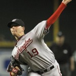 Washington Nationals' Scott Olsen throws against the Arizona Diamondbacks during the first inning of a baseball game Tuesday, Aug. 3, 2010, in Phoenix. (AP Photo/Ross D. Franklin)