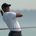 Tiger Woods drops his club as he drives on the fifth hole during the first round of the PGA Championship golf tournament Thursday, Aug. 12, 2010, at Whistling Straits in Haven, Wis. (AP Photo/Charlie Riedel)