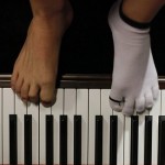 In this Aug. 26, 2010 photo, pianist Liu Wei plays the piano with his toes during his practice session in Shanghai. The 23-year-old, whose arms were amputated after a childhood accident, plays the piano with his toes. Liu was thrust into the limelight earlier this month when he performed on "China's Got Talent," the Chinese version of the TV show that helped make Britain's Susan Boyle a singing star. (AP Photo/Eugene Hoshiko)
 