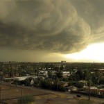 Storm clouds carrying heavy rain move across downtown Phoenix, Tuesday afternoon, Oct. 5, 2010. A series of powerful thunderstorms hit the area with high winds, hail and heavy rain. (AP Photo/Tom Stathis)