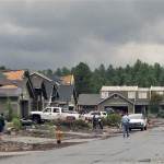Residents survey damage from a tornado that hit of Bellemont, Ariz., west of Flagstaff on Wednesday, Oct. 6, 2010. Fifteen homes in Bellemont were so badly damaged that they were uninhabitable and the estimated 30 people who lived in them were evacuated. (AP Photo/Felicia Fonseca)
