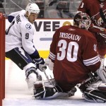 Tampa Bay Lightning's Steve Downie (9) gets the puck past Phoenix Coyotes' Ilya Bryzgalov (30), of Russia, but the puck does not go into the net in the first period of an NHL hockey game Saturday, Oct. 30, 2010, in Glendale, Ariz. (AP Photo/Ross D. Franklin)