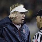 Arizona coach Mike Stoops, left, makes a point to an official against Stanford in the second quarter of an NCAA college football game in Stanford, Calif., Saturday, Nov. 6, 2010. (AP Photo/Paul Sakuma)