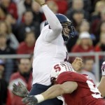 Arizona quarterback Nick Foles throws the ball as he is hit by Stanford's Thomas Keiser during the first quarter of an NCAA college football game in Stanford, Calif., Saturday, Nov. 6, 2010. (AP Photo/Paul Sakuma)