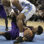 Denver Nuggets point guard Chauncey Billups (1) tries to steal the ball from Phoenix Suns shooting guard Josh Childress (1) before he calls a time out during the fourth quarter of an NBA basketball game in Denver, Nov. 28, 2010. Nuggets won 138-133. (AP Photo/Barry Gutierrez)