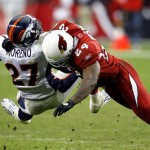 Arizona Cardinals safety Adrian Wilson, right, tackles Denver Broncos running back Knowshon Moreno during the second quarter of an NFL football game Sunday, Dec. 12, 2010 in Glendale, Ariz. (AP Photo/Rick Scuteri)