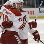 Phoenix Coyotes' Adrian Aucoin, right, celebrates with teammate Paul Bissonnette, left, after scoring a goal during the first period of an NHL hockey game against the New York Rangers, Thursday, Dec. 16, 2010, in New York. (AP Photo/Frank Franklin II)