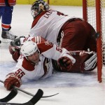 Phoenix Coyotes' Ed Jovanovski (55) blocks a shot on the goal as Coyotes goalie Jason LaBarbera looks on during the second period of an NHL hockey game against the New York Rangers, Thursday, Dec. 16, 2010, in New York. Jovanovski was hurt on the play. (AP Photo/Frank Franklin II)