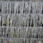 Icicles form a pattern on a barbwire fence Tuesday, Dec. 14, 2010 in Plant City, Fla. Farmers spray a fine mist of water on their crops to help protect the fruit from the sub-freezing temperatures. Temperatures in central Florida dipped into the 20's. (AP Photo/Chris O'Meara)