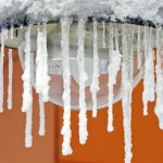 Icicles hang at a lantern after heavy snowfalls and low temperatures in the Thuringian Forest in Oberhof, Germany, Thursday, Dec. 2, 2010. Large parts of Germany were hit by heavy snowfalls and icy wind. The winter weather with temperatures around the freezing point will continue tomorrow, according to forecasts. (AP Photo/Jens Meyer)