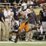 Oklahoma State's Justin Blackmon runs for a touchdown after making a catch during the first quarter of the Alamo Bowl NCAA college football game against Arizona, Wednesday, Dec. 29, 2010, in San Antonio. (AP Photo/Eric Gay)