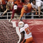 Oklahoma State's Justin Blackmon (81) celebrates with fans after scoring a touchdown during the first quarter of the Alamo Bowl NCAA college football game against Arizona, Wednesday, Dec. 29, 2010, in San Antonio. (AP Photo/Eric Gay)