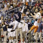 Arizona's Joseph Perkins (9) deflects a pass intended for Oklahoma State's Josh Cooper (25) during the second quarter of the Alamo Bowl NCAA college football game, Wednesday, Dec. 29, 2010, in San Antonio. (AP Photo/Eric Gay)