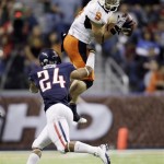Oklahoma State's Bo Bowling (9) makes a leaping catch as Arizona's Trevin Wade (24) defends the play during the third quarter of the Alamo Bowl NCAA college football game Wednesday, Dec. 29, 2010, in San Antonio. (AP Photo/Eric Gay)