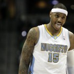 Denver Nuggets small forward Carmelo Anthony (15) reacts after being fouled while playing the Phoenix Suns in the first half of an NBA basketball game in Denver Tuesday, Jan. 11, 2011. (AP Photo/Barry Gutierrez)