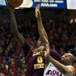 Arizona States' Carrick Felix (0) shoots over Arizona's Jamelle Horne (42) in the first half of an NCAA college basketball game at McKale Center, Saturday, Jan. 15, 2011, in Tucson, Ariz. (AP Photo/Wily Low)