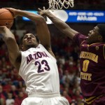Arizona's Derrick Williams (23) shoots over Arizona States' Carrick Felix (0) in the second half of an NCAA college basketball game at McKale Center, Saturday, Jan. 15, 2011, in Tucson, Ariz. Williams scored 31 points to set a career high for the second time in three games and Arizona won 80-69. (AP Photo/Wily Low)