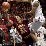 Arizona's Jesse Perry, right, attempts to block the shot of Arizona States' Trent Lockett (24) during the second half of an NCAA college basketball game at McKale Center in Tucson, Ariz., Saturday, Jan. 15, 2011. Arizona 80-69. (AP Photo/John Miller)