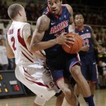 Arizona forward Jesse Perry (33) drives around Stanford guard Aaron Bright (2) in the first half of an NCAA college basketball game in Stanford, Calif., Thursday, Feb. 3, 2011. (AP Photo/Paul Sakuma)