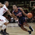 Arizona's Derrick Williams drives in front of Stanford forward Josh Owens (13) in the first half of an NCAA college basketball game in Stanford, Calif., Thursday, Feb. 3, 2011. (AP Photo/Paul Sakuma)