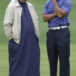 Ismail Sharif from the United Arab Emirates, left, with Tiger Woods during the Pro-Am at the Emirates Golf Club a day ahead of Dubai Desert Classic golf tournament in Dubai, United Arab Emirates, Wednesday Feb. 9, 2011. (AP Photo/Kamran Jebreili)