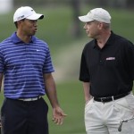 American army officer Lt. Col. Micheal Rowells, right, talks with Tiger Woods during the Pro-Am at the Emirates Golf Club a day ahead of Dubai Desert Classic golf tournament in Dubai, United Arab Emirates, Wednesday Feb. 9, 2011. (AP Photo/Kamran Jebreili)