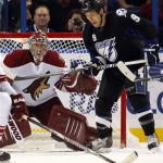 Tampa Bay Lightning's Steve Downie, right, looks to deflect a puck in front of Phoenix Coyotes goalie Jason LaBarbera during the first period of an NHL hockey game Wednesday, Feb. 23, 2011, in Tampa, Fla. (AP Photo/Mike Carlson)