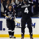 Tampa Bay Lightning's Martin St. Louis, left, celebrates his first-period goal against the Phoenix Coyotes with teammate Vincent Lecavalier in an NHL hockey game Wednesday, Feb. 23, 2011, in Tampa, Fla. (AP Photo/Mike Carlson)
