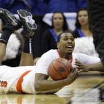 Syracuse's Kris Joseph calls a time out after diving for a loose ball in the second half of an East regional NCAA college basketball tournament second round game against Indiana State Saturday, March 19, 2011, in Cleveland. (AP Photo)