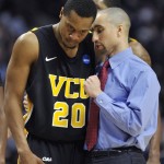 Virginia Commonwealth head coach Shaka Smart talks with Bradford Burgess (20) on the sideline in the second half of a second-round NCAA Southwest Regional tournament college basketball game against Georgetown in Chicago, Friday, March 18, 2011. (AP Photo/Jim Prisching)