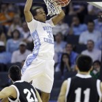 North Carolina forward John Henson (31) dunks the ball as Long Island forward Arnold Mayorga (21) and Long Island guard Jason Brickman (11) watch in the first half of an East Regional NCAA tournament second-round college basketball game, Friday, March 18, 2011, in Charlotte, N.C. (AP Photo)