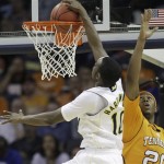 Michigan guard Tim Hardaway Jr. (10) dunks the ball as Tennessee forward Kenny Hall (20) defends in the second half of a West Regional NCAA tournament second round college basketball game, Friday, March 18, 2011, in Charlotte, N.C. (AP Photo)