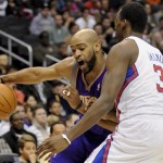 Phoenix Suns guard Vince Carter, left, drives on Los Angeles Clippers forward Al-Farouq Aminu (3) in the first half of an NBA basketball game, Sunday, March 20, 2011, in Los Angeles. (AP Photo/Gus Ruelas)