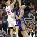 Los Angeles Clippers center Chris Kaman (35) shoot over Phoenix Suns center Marcin Gortat, right, of Poland, for a basket in the first half of an NBA basketball game, Sunday, March 20, 2011, in Los Angeles. (AP Photo/Gus Ruelas)