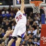 Los Angeles Clippers forward Blake Griffin (32) commits an offensive charging foul on Phoenix Suns center Marcin Gortat (4), of Poland, as he attempts to dunk in the second half of an NBA basketball game, Sunday, March 20, 2011, in Los Angeles. The Suns won 108-99. (AP Photo/Gus Ruelas)