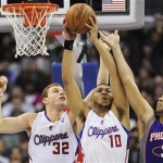 Los Angeles Clippers forward Blake Griffin (32), guard Eric Gordon (10) and Phoenix Suns forward Jared Dudley (3) fight for a rebound in the second half of an NBA basketball game, Sunday, March 20, 2011, in Los Angeles. The Suns won 108-99. (AP Photo/Gus Ruelas)