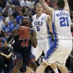 Arizona's Solomon Hill (44) looks to shoot against Duke's Miles Plumlee (21) and Mason Plumlee (5) during the first half of a West regional semifinal in the NCAA college basketball tournament Thursday, March 24, 2011, in Anaheim, Calif. (AP Photo/Jae C. Hong)