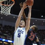 Duke's Mason Plumlee (5) and Arizona's Derrick Williams (23) stretch for a rebound during the first half of a West regional semifinal in the NCAA college basketball tournament Thursday, March 24, 2011, in Anaheim, Calif. (AP Photo/Mark J. Terrill)