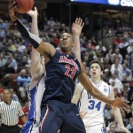Arizona's Derrick Williams (23) grabs a rebound in front of Duke's Kyle Singler and Ryan Kelly (34) during the first half of a West regional semifinal game in the NCAA college basketball tournament, Thursday, March 24, 2011, in Anaheim, Calif. (AP Photo/Jae C. Hong)