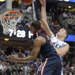 Arizona's Derrick Williams is fouled by Duke's Miles Plumlee (21) during the first half of a West regional semifinal in the NCAA college basketball tournament Thursday, March 24, 2011, in Anaheim, Calif. (AP Photo/Jae C. Hong)