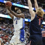 Duke's Kyrie Irving, left, shoots against Arizona's Kyryl Natyazhko during the first half of a West regional semifinal in the NCAA college basketball tournament Thursday, March 24, 2011, in Anaheim, Calif. (AP Photo/Mark J. Terrill)