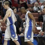 Duke coach Mike Krzyzewski and seniors Kyle Singler (12) and Nolan Smith (2) walk off the court after Duke's 93-77 loss to Arizona a West regional semifinal in the NCAA college basketball tournament, Thursday, March 24, 2011, in Anaheim, Calif. (AP Photo/Jae C. Hong)