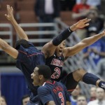 Arizona's Lamont Jones, center left, and Derrick Williams (23) celebrate after Arizona defeated Duke 93-77 in a West regional semifinal in the NCAA college basketball tournament, Thursday, March 24, 2011, in Anaheim, Calif. (AP Photo/Jae C. Hong