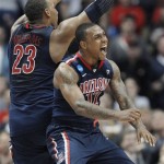 Arizona's Lamont Jones (12) and Derrick Williams (23) celebrate after Arizona defeated Duke 93-77 in a West regional semifinal in the NCAA college basketball tournament, Thursday, March 24, 2011, in Anaheim, Calif. (AP Photo/Jae C. Hong)