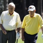 Arnold Palmer, left, chats with Jack Nicklaus on the first hole during the Par 3 competition before the Masters golf tournament Wednesday, April 6, 2011, in Augusta, Ga. (AP Photo/Chris O'Meara)
